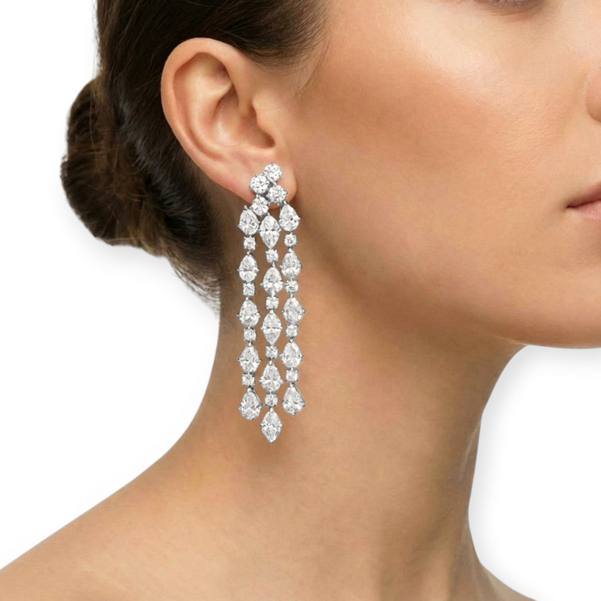 hofjewellery Bullicula 18K white gold tassel earrings with pear, marquise, and round cut diamonds on a model