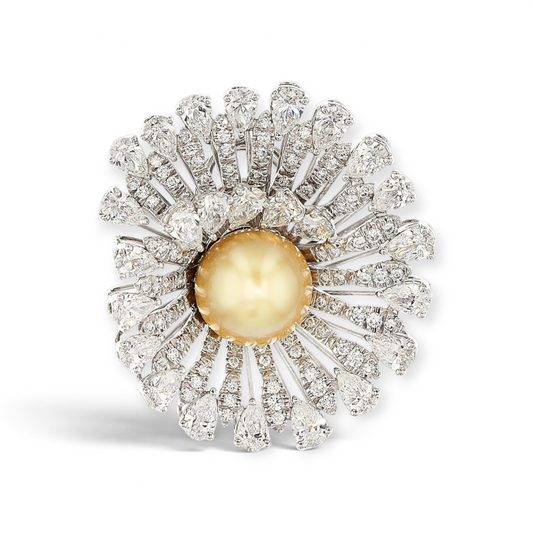 An 18K White Gold Ring/Pendant featuring a South Sea Golden Pearl, 1.10ct Round Diamonds, and 7.12ct Pear-Shaped Diamonds, with a foldable shank for seamless conversion into a pendant.