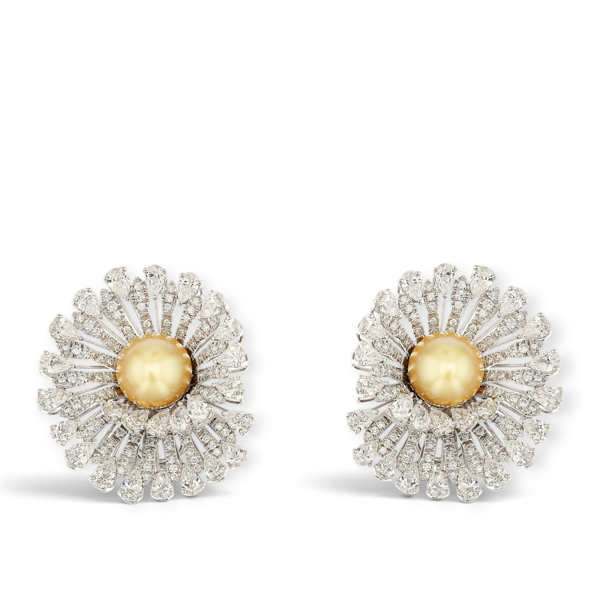 18K White Gold Earrings featuring 2 South Sea Golden Pearls, 9.78ct Pear-Shaped and 1.48ct Round Natural Diamonds in a bold, three-dimensional swirl vortex design.