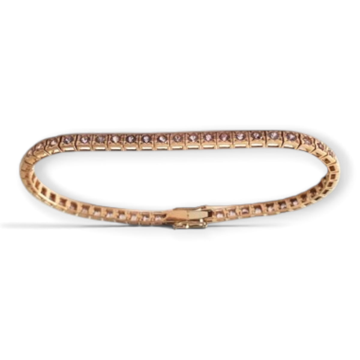 Pink sapphire tennis bracelet in 18K rose gold, shown in an oval arrangement with its clasp, reference 2515B.