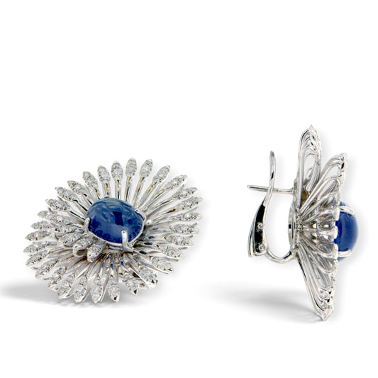 Blue cabochon sapphire and diamond swirl earrings in 18K white gold, shown from the front and side, reference 4216.
