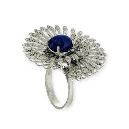 hofjewellery 18K white gold cocktail ring featuring a 3.82ct cabochon sapphire center with diamond swirl accents.