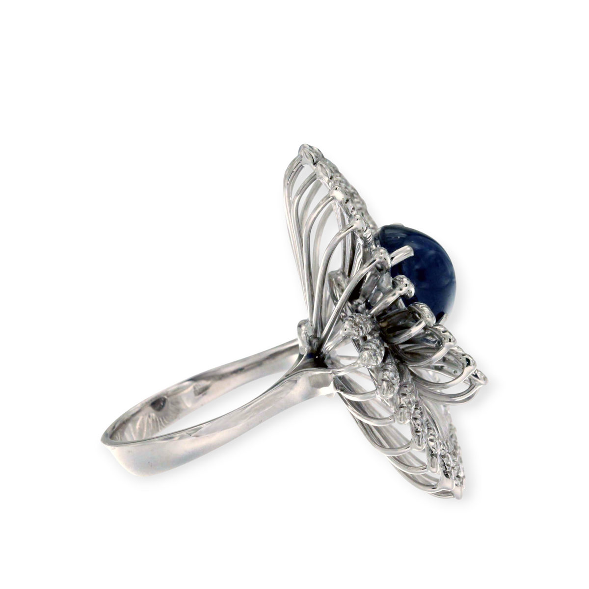 hofjewellery 18K white gold cocktail ring featuring a central cabochon sapphire and diamond-adorned swirl design.