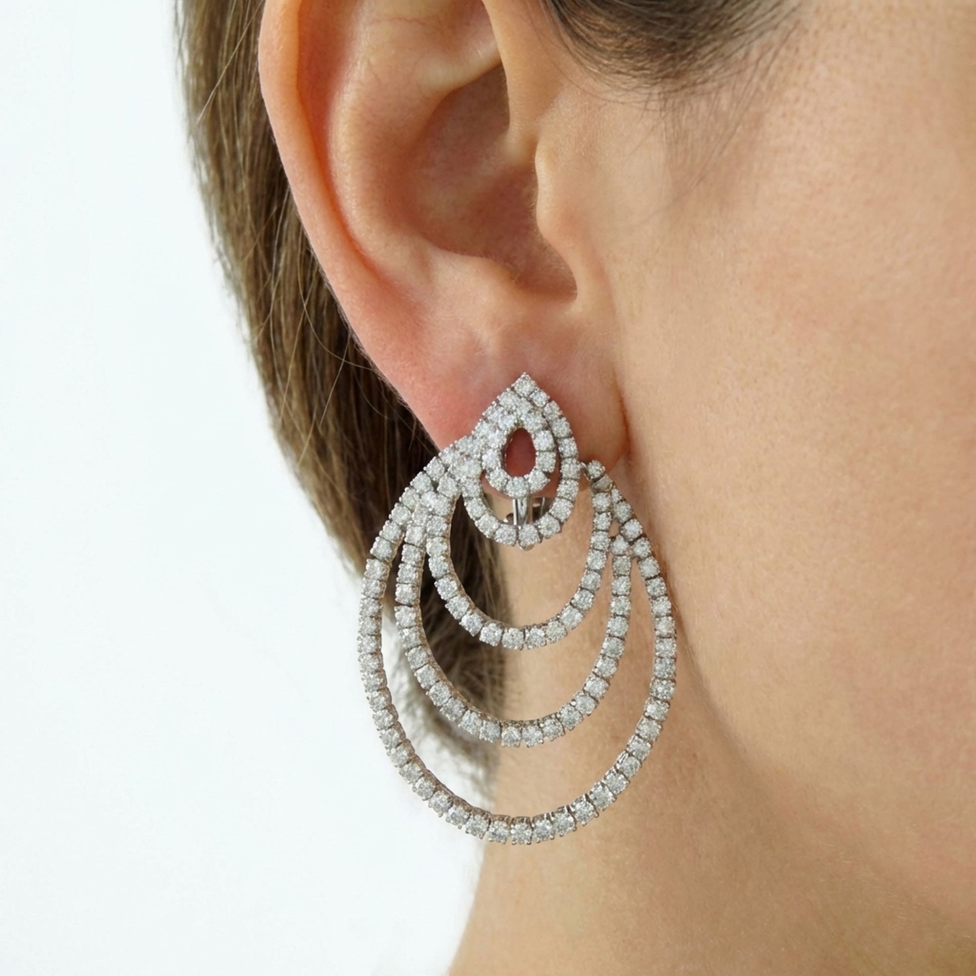 hofjewellery 18k white gold drop earrings featuring round and pear-shaped natural diamonds on a model