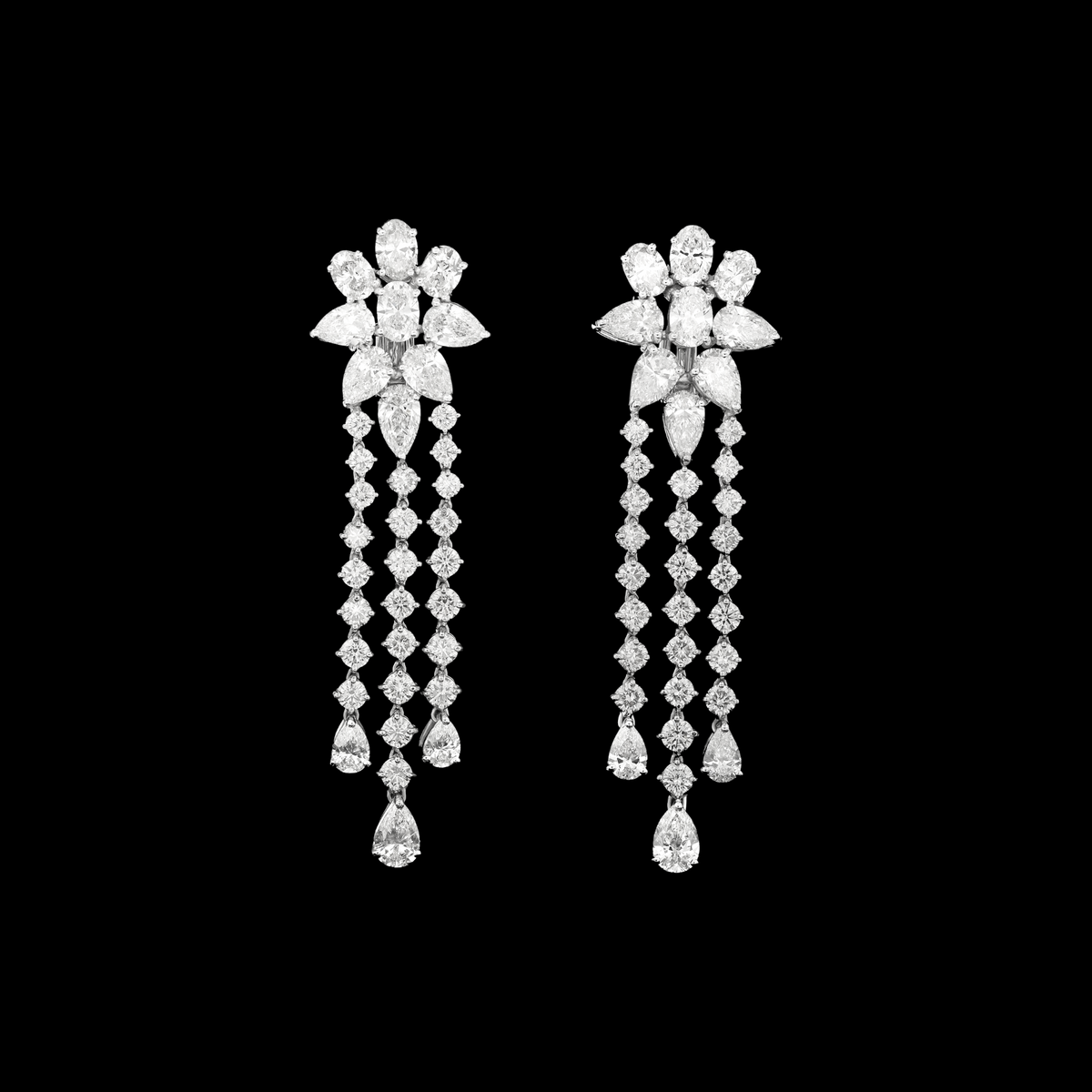 hofjewellery 18K white gold drop earrings with floral diamond clusters and cascading three-row pear and round diamonds