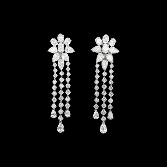 hofjewellery 18K white gold drop earrings with floral diamond clusters and cascading three-row pear and round diamonds