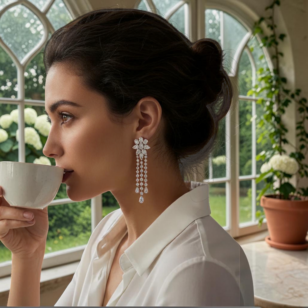 hofjewellery 18K white gold drop earrings with pear, oval, and round diamonds in a floral cascading three-row design.