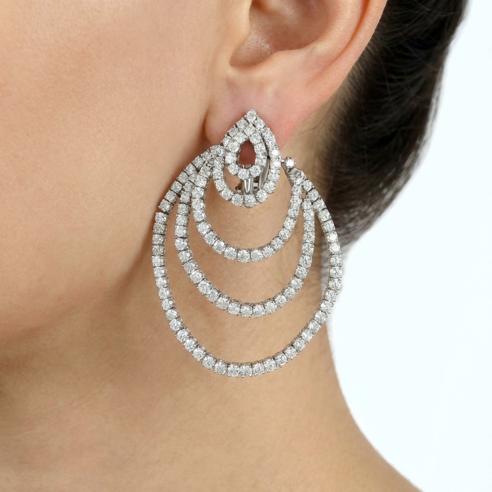 hofjewellery 18k white gold statement earrings featuring layered diamond hoops with round and pear-shaped diamonds.