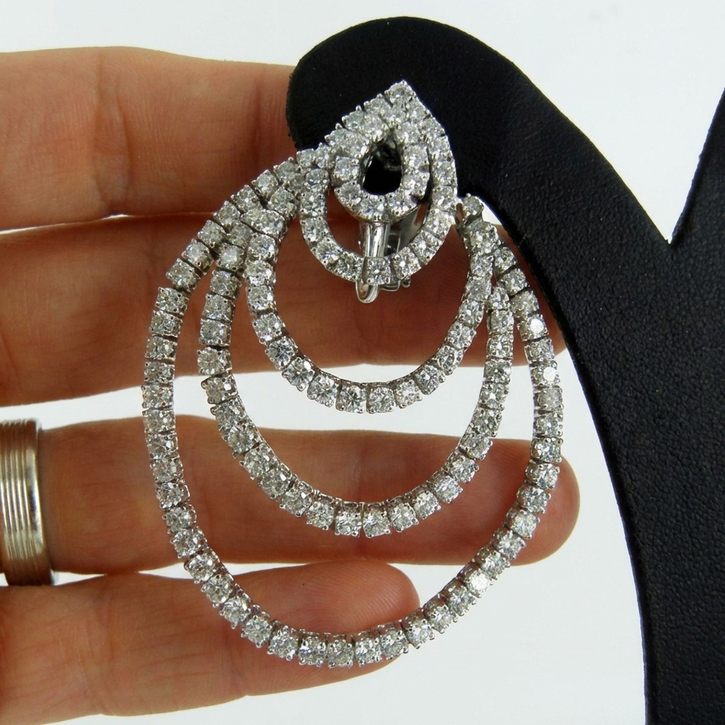 hofjewellery 18k white gold statement earring featuring concentric diamond circles with round and pear-cut stones.