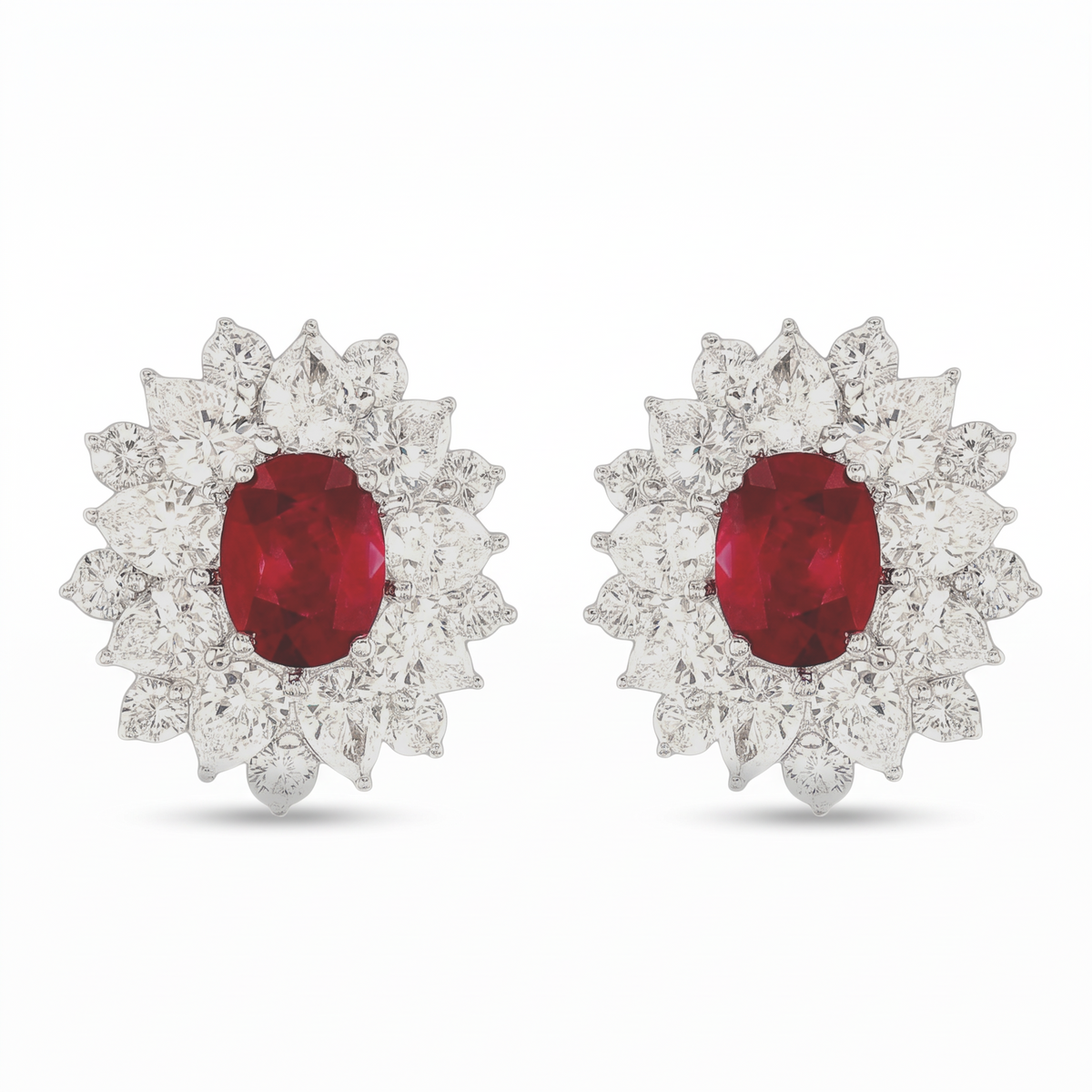 hofjewellery platinum earrings featuring oval Burmese pigeon blood rubies surrounded by round brilliant diamonds