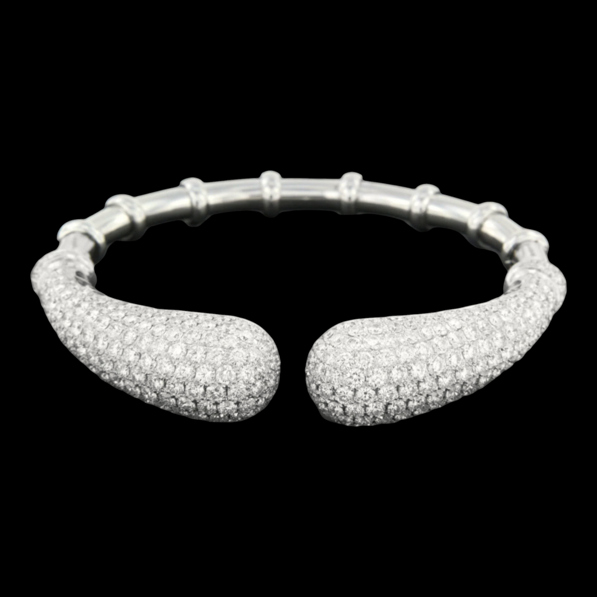 hofjewellery 18K white gold open cuff bracelet with 14.51 carats of pavé-set diamonds on tapered ends.
