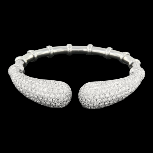 hofjewellery 18K white gold open cuff bracelet with 14.51 carats of pavé-set diamonds on tapered ends.