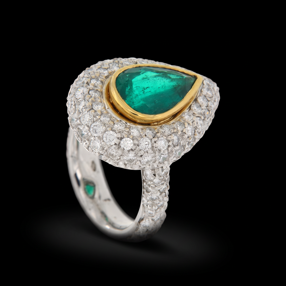 hofjewellery pear-shaped Colombian emerald ring with diamond halo and pavé-set band in 18K white gold