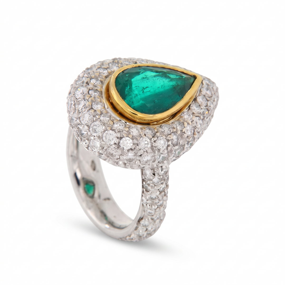 hofjewellery pear-shaped Colombian emerald ring with a diamond halo set in 18K white gold with a pavé diamond band