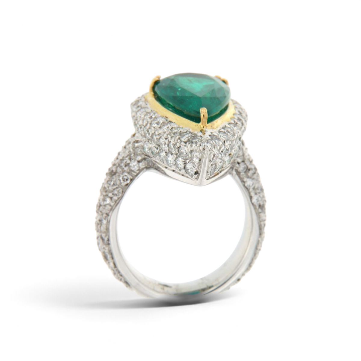 hofjewellery pear-shaped Colombian emerald ring with a diamond halo set in 18K white gold with a pavé diamond band.
