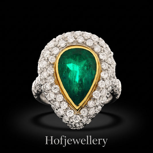hofjewellery pear-shaped Colombian emerald ring with a diamond halo set in 18K white gold on a black background