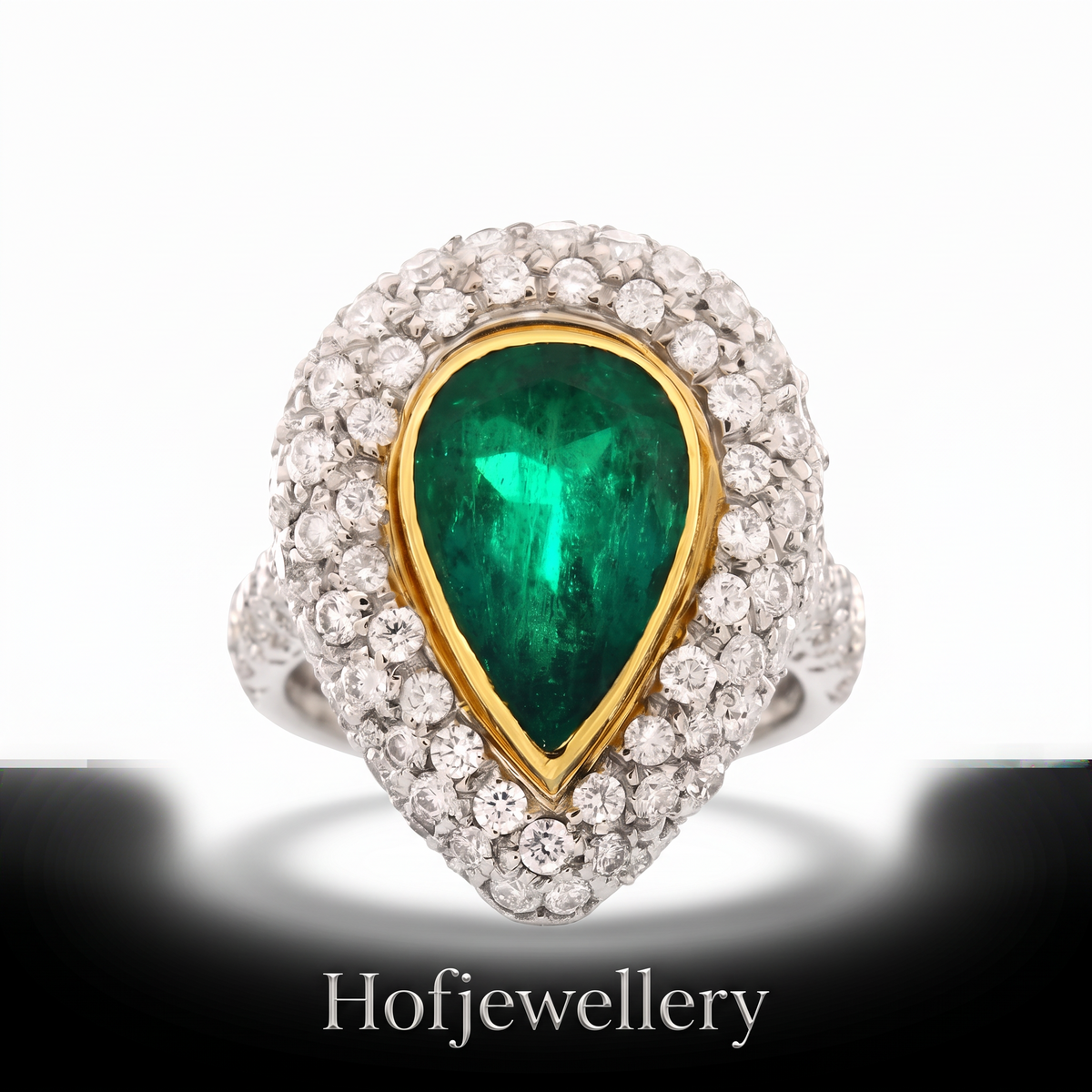 hofjewellery 18K white gold ring featuring a pear-shaped Colombian emerald surrounded by a sparkling diamond halo.