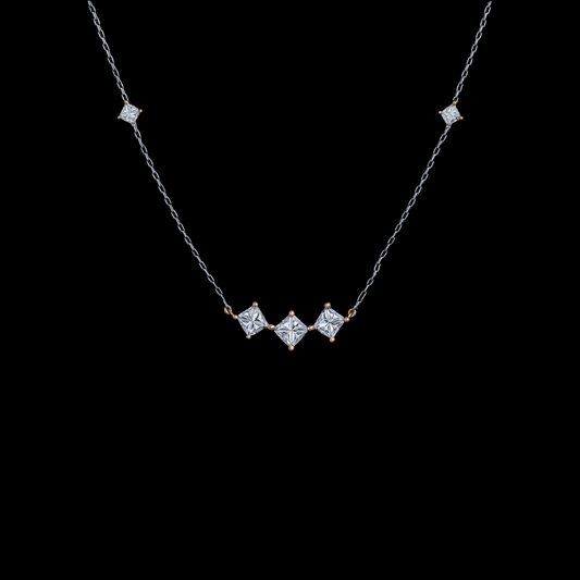 hofjewellery princess-cut diamond necklace in 18K rose and white gold with a delicate chain on a black background