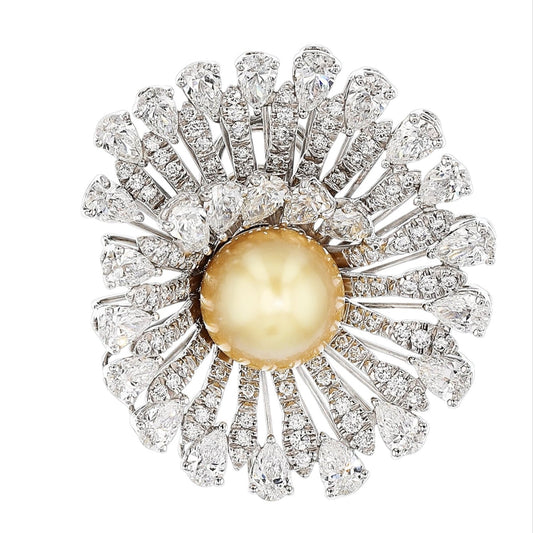 An 18K White Gold Ring/Pendant featuring a South Sea Golden Pearl, 1.10ct Round Diamonds, and 7.12ct Pear-Shaped Diamonds, with a foldable shank for seamless conversion into a pendant.